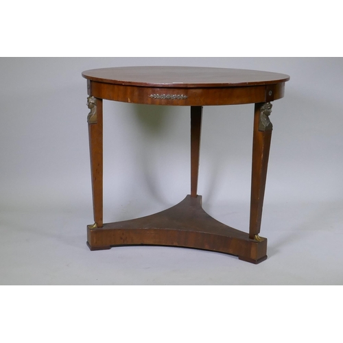 1027 - A late C19th Empire style French mahogany gueridon with brass mounts raised on tapering supports uni... 