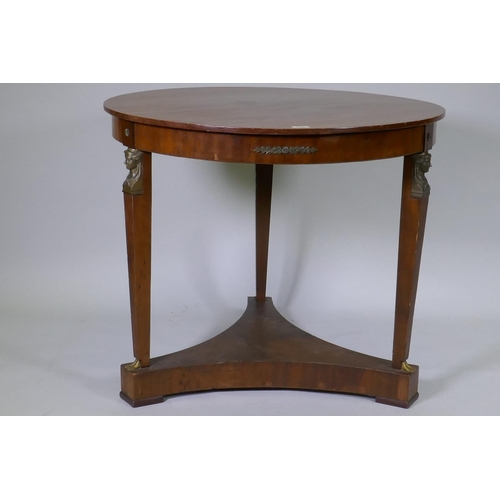 1027 - A late C19th Empire style French mahogany gueridon with brass mounts raised on tapering supports uni... 