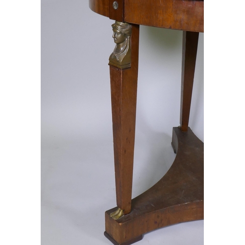 1027 - A late C19th Empire style French mahogany gueridon with brass mounts raised on tapering supports uni... 