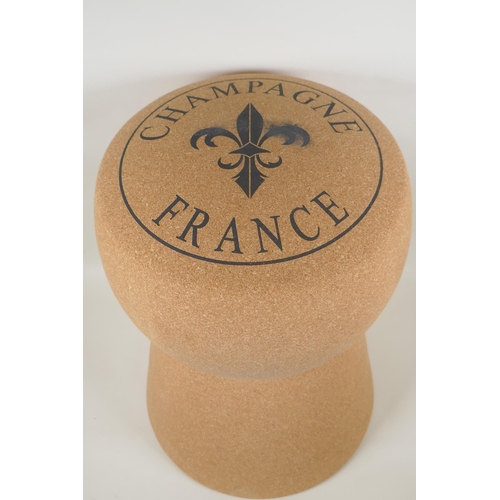 1031 - A cork and metal stool in the form of a Champagne cork, 51cm high