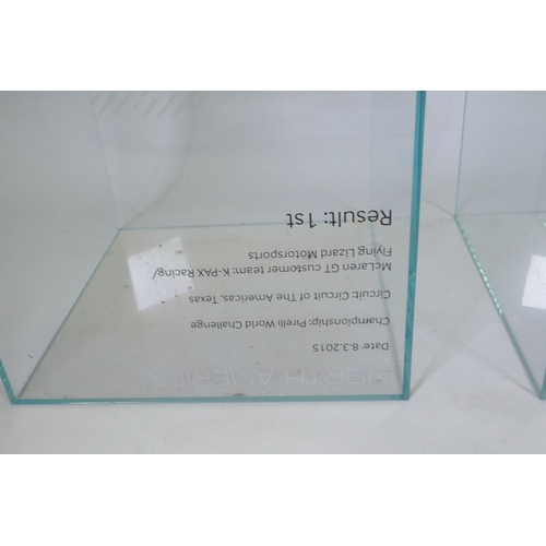 1037 - A pair of large glass display plinths/planters, formerly used by McLaren Racing, 48 x 48cm, 75cm hig... 