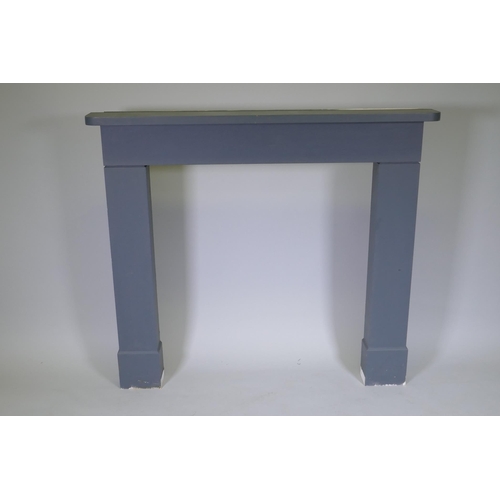 1043 - A painted wood fire surround, 131cm wide, 115cm high