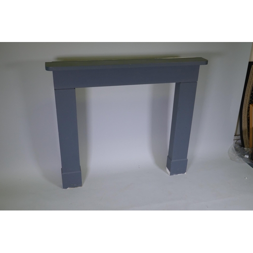 1043 - A painted wood fire surround, 131cm wide, 115cm high