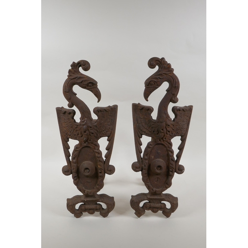 1046 - A pair of antique cast iron fire andirons in the form of phoenix, 40cm high