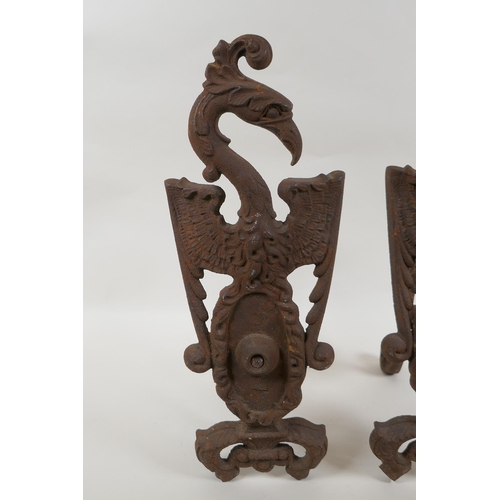 1046 - A pair of antique cast iron fire andirons in the form of phoenix, 40cm high