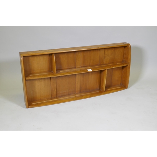 1048 - An Ercol elm Windsor plate rack, model 386, 107 x 13cm, 50cm high