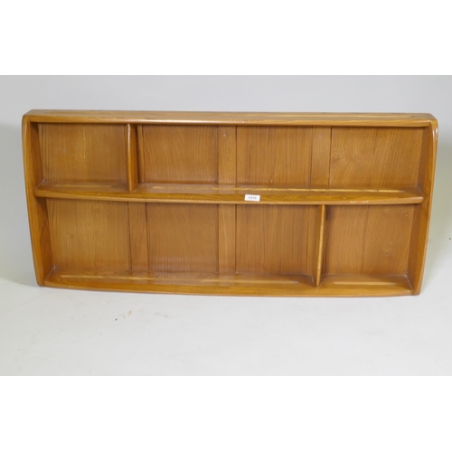 1048 - An Ercol elm Windsor plate rack, model 386, 107 x 13cm, 50cm high