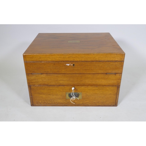 1049 - A late C19th/early C20th oak campaign canteen/box, with fold out sections, 56 x 46cm, 36cm high