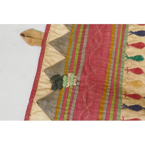 105 - A C19th Indian embroidered wall hanging decorated with depictions of Ganesh, peacocks, elephants, co... 