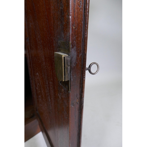 1057 - A C19th Regency style Colonial figured hardwood chiffonier, the upper shelf with scroll supports, a ... 