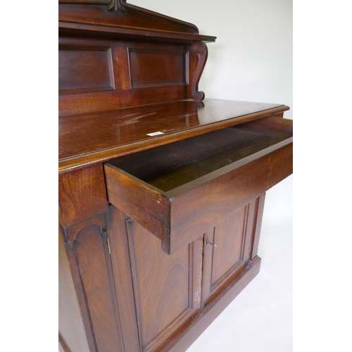 1057 - A C19th Regency style Colonial figured hardwood chiffonier, the upper shelf with scroll supports, a ... 