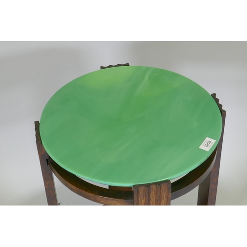 1059 - An Art Deco occasional table with marbled green glass top and undertier, 66cm high x 42cm diameter