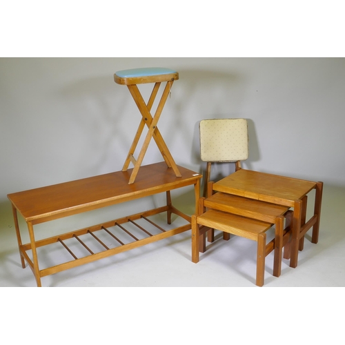 1060 - A 1970s teak coffee table with magazine rack, a nest of three 70s/80s occasional tables and two mid ... 