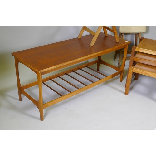 1060 - A 1970s teak coffee table with magazine rack, a nest of three 70s/80s occasional tables and two mid ... 