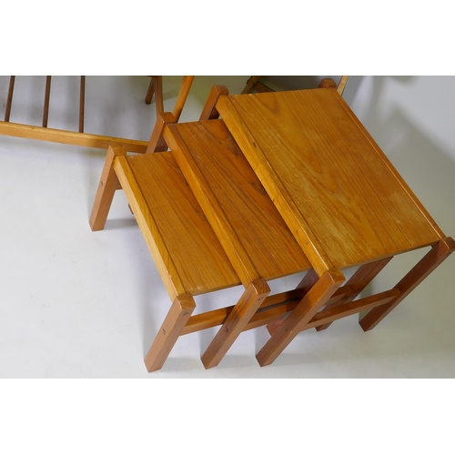 1060 - A 1970s teak coffee table with magazine rack, a nest of three 70s/80s occasional tables and two mid ... 