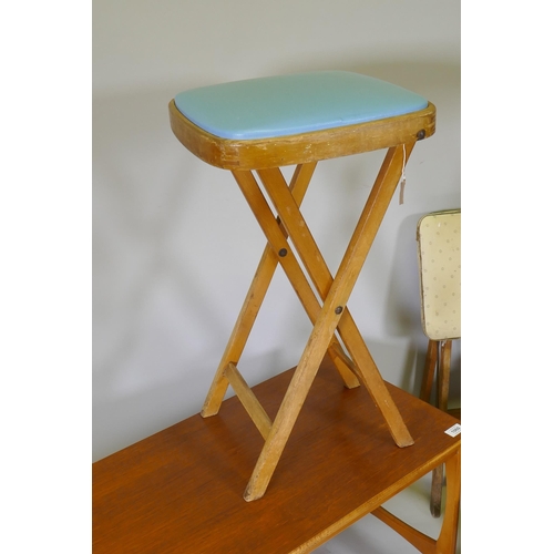 1060 - A 1970s teak coffee table with magazine rack, a nest of three 70s/80s occasional tables and two mid ... 