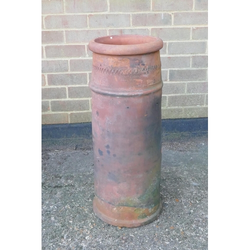 1061 - A terracotta chimney pot, 75cm high, 29cm diameter