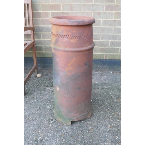 1061 - A terracotta chimney pot, 75cm high, 29cm diameter