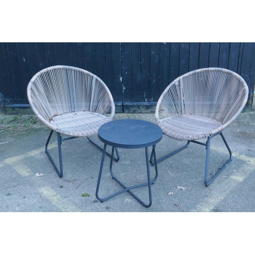 1063 - A pair of contemporary faux cane garden chairs and matching occasional table