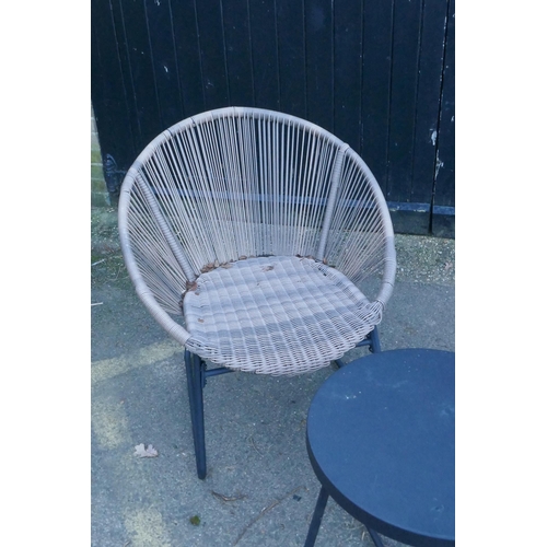 1063 - A pair of contemporary faux cane garden chairs and matching occasional table