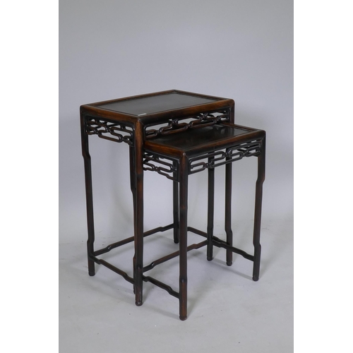 1066 - A nest of two C19th Chinese hardwood side tables with pierced friezes and shaped supports, 45 x 31 x... 