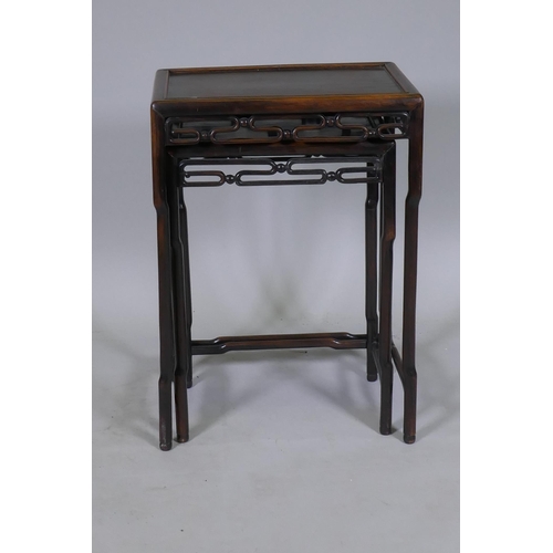 1066 - A nest of two C19th Chinese hardwood side tables with pierced friezes and shaped supports, 45 x 31 x... 