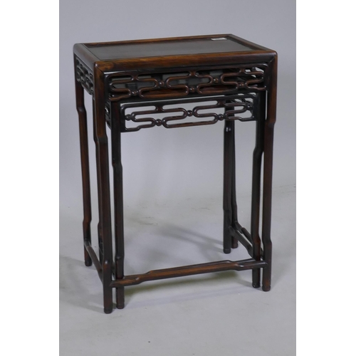 1066 - A nest of two C19th Chinese hardwood side tables with pierced friezes and shaped supports, 45 x 31 x... 