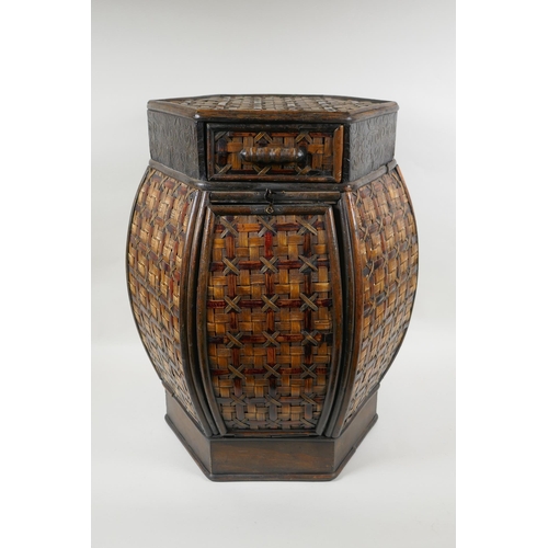 1067 - A hexagonal oriental cane lamp table/stool, 51cm high