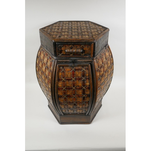 1067 - A hexagonal oriental cane lamp table/stool, 51cm high