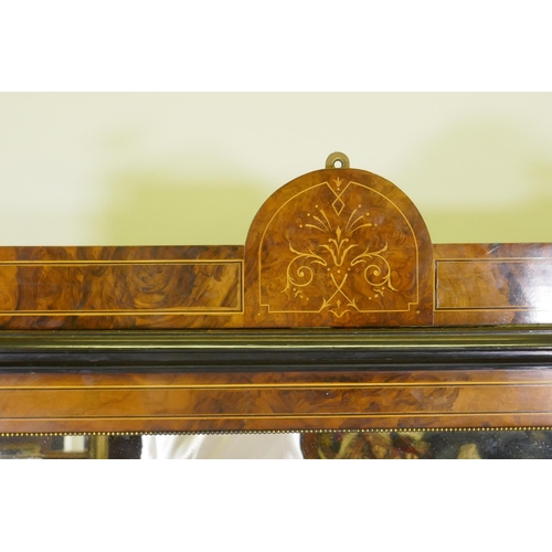 1071 - A Victorian inlaid figured walnut side cabinet, the mirrored back with galleried shelves, the base w... 