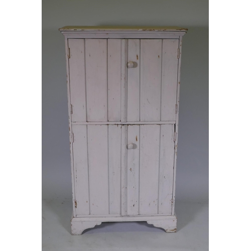 1075 - A French painted pine store cabinet, 66 x 30cm, 122cm high