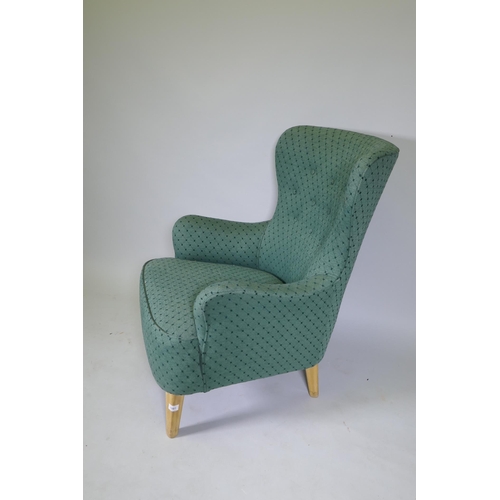 1081 - Theo Ruth, mid century armchair, raised on beechwood supports, stamped 'K', with good upholstery