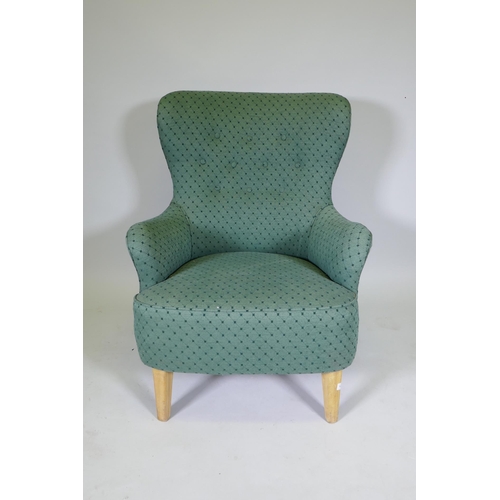 1081 - Theo Ruth, mid century armchair, raised on beechwood supports, stamped 'K', with good upholstery