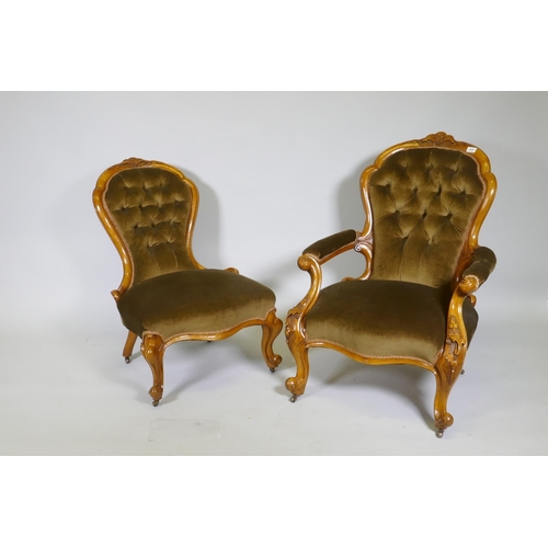 1083 - A Victorian gentleman's walnut show frame armchair with carved decoration, raised on cabriole suppor... 