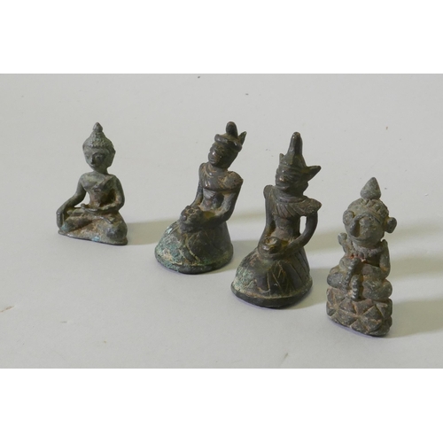 109 - Four Eastern bronze miniature Buddhivistic figures, 5cm high