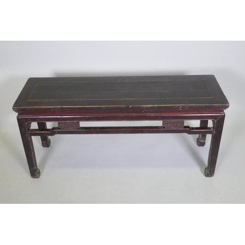 1098 - A Chinese hardwood low table, 109 x 34cm 50cm high