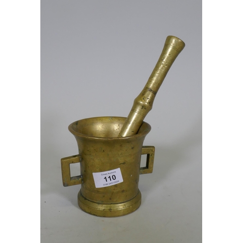 110 - Antique bronze pestle and mortar, pestle 25cm long