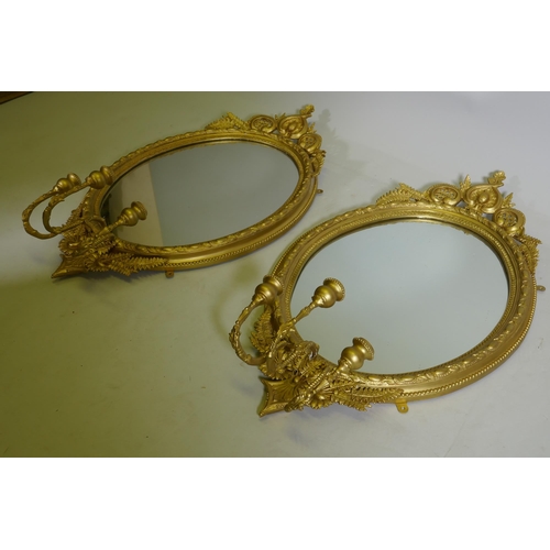 1101 - A pair of Victorian giltwood and composition three branch girondelle wall mirrors, 96cm long