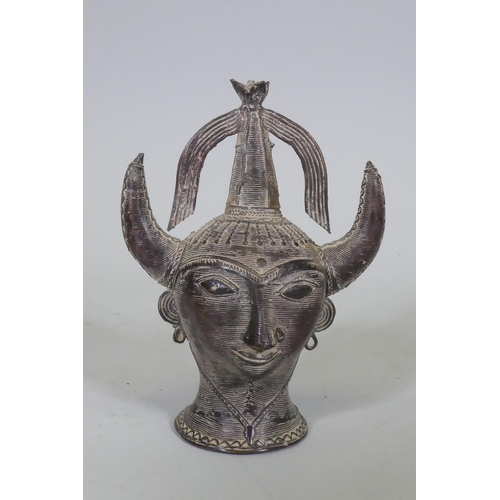 111 - An Eastern bronze head of Saturn with horned headdress, 20cm high