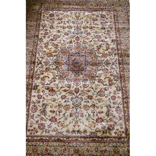 1122 - A Kashmiri ivory ground full pile rug with all over floral design, 117 x 170cm