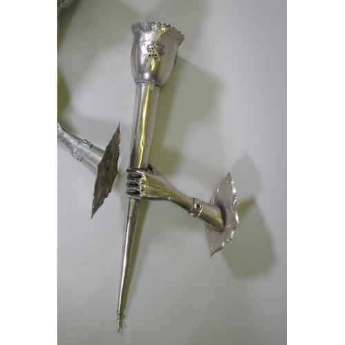 1133 - A pair of large white metal wall sconces in the form of a hand bearing a torch, 126 x 43cm