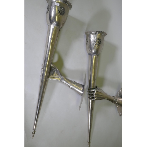 1133 - A pair of large white metal wall sconces in the form of a hand bearing a torch, 126 x 43cm