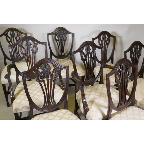 1136 - A set of eight (six plus two) Hepplewhite style shield back chairs, with over stuffed serpentine fro... 