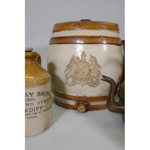 114 - A quantity of antique stoneware jars, a flask and two gallon keg with royal warrant, a coal bucket a... 