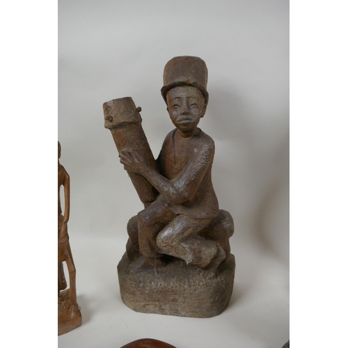 117 - A collection of vintage African carved hardwood figures, largest 56cm high