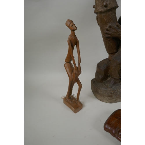 117 - A collection of vintage African carved hardwood figures, largest 56cm high