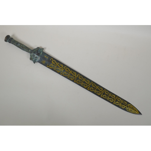 118 - An archaic style Chinese bronze short sword with stylised dragon decoration, 63cm long