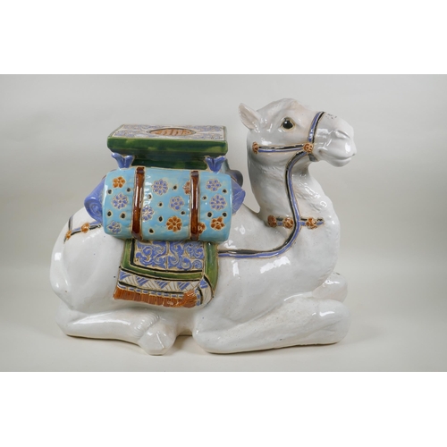 119 - A Chinese ceramic garden seat in the form of a camel, 60cm long, 45cm high