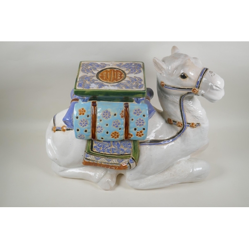 119 - A Chinese ceramic garden seat in the form of a camel, 60cm long, 45cm high