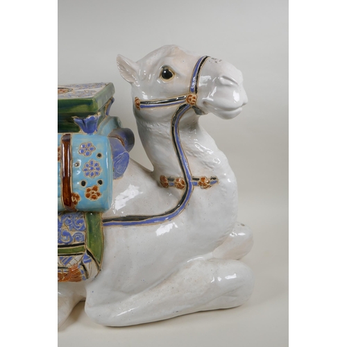 119 - A Chinese ceramic garden seat in the form of a camel, 60cm long, 45cm high